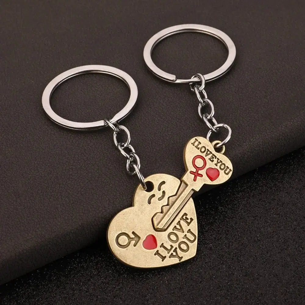 Pair of heart-shaped keychain with 'I Love You' text on a dark background