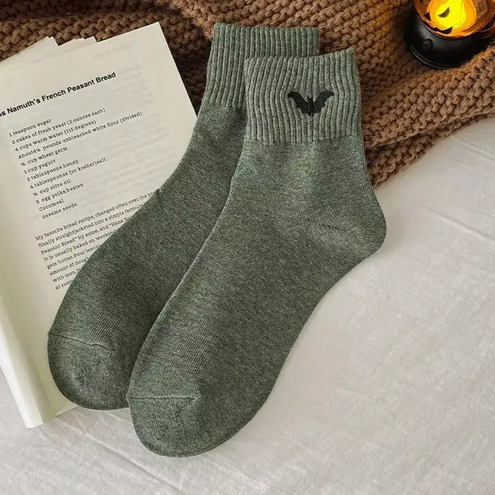 Crew socks featuring a small embroidered bat for Halloween