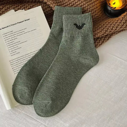 Crew socks featuring a small embroidered bat for Halloween