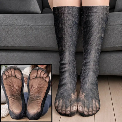 Dark furry gorilla foot socks with human like sole texture worn on legs before a gray sofa