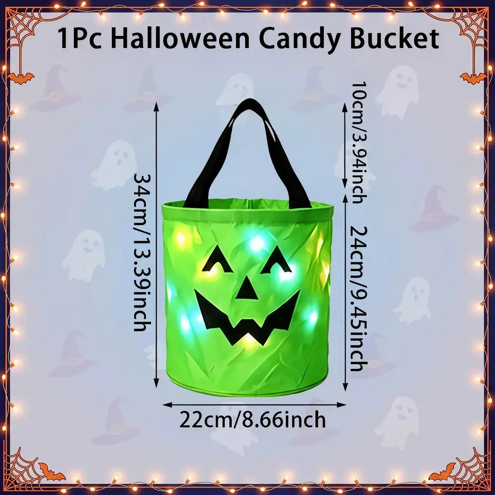 A green inflatable Halloween candy bucket with black handles and a jack-o'-lantern face, shown with overlaid dimensions (34 cm tall, 22 cm wide) and a lighted glow effect. The image includes the text '1Pc Halloween Candy Bucket' and a decorative Halloween border with ghosts and spiderwebs.