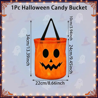 An orange Halloween candy bucket with a jack-o'-lantern face and black handles, shown with printed dimension arrows and labels on a pale blue decorative background.