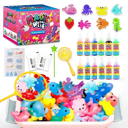 Magic Water Elf colorful magic kit shown with its pink retail box, bottles of liquid, stickers, instruction sheet, wand, and a tub filled with colorful gelatin animal figures on a white background.
