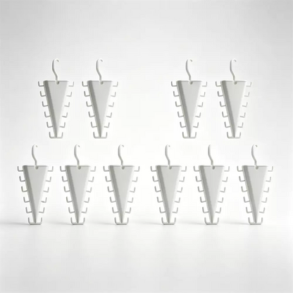 Nine white plastic jewelry display stands arranged in two rows on a clean white background.