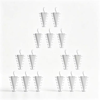 A set of white, cone-shaped novelty candles arranged in a pyramid pattern against a solid white background.