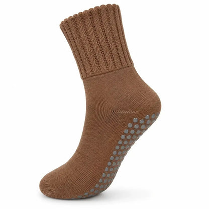 A single brown ankle sock with gray non-slip grip dots on the sole, shown against a plain white background.