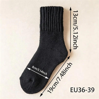 A single black ribbed knit sock shown on a light beige background with overlaid dimension arrows and text indicating measurements: 13 cm / 5.12 inch height, 19 cm / 7.